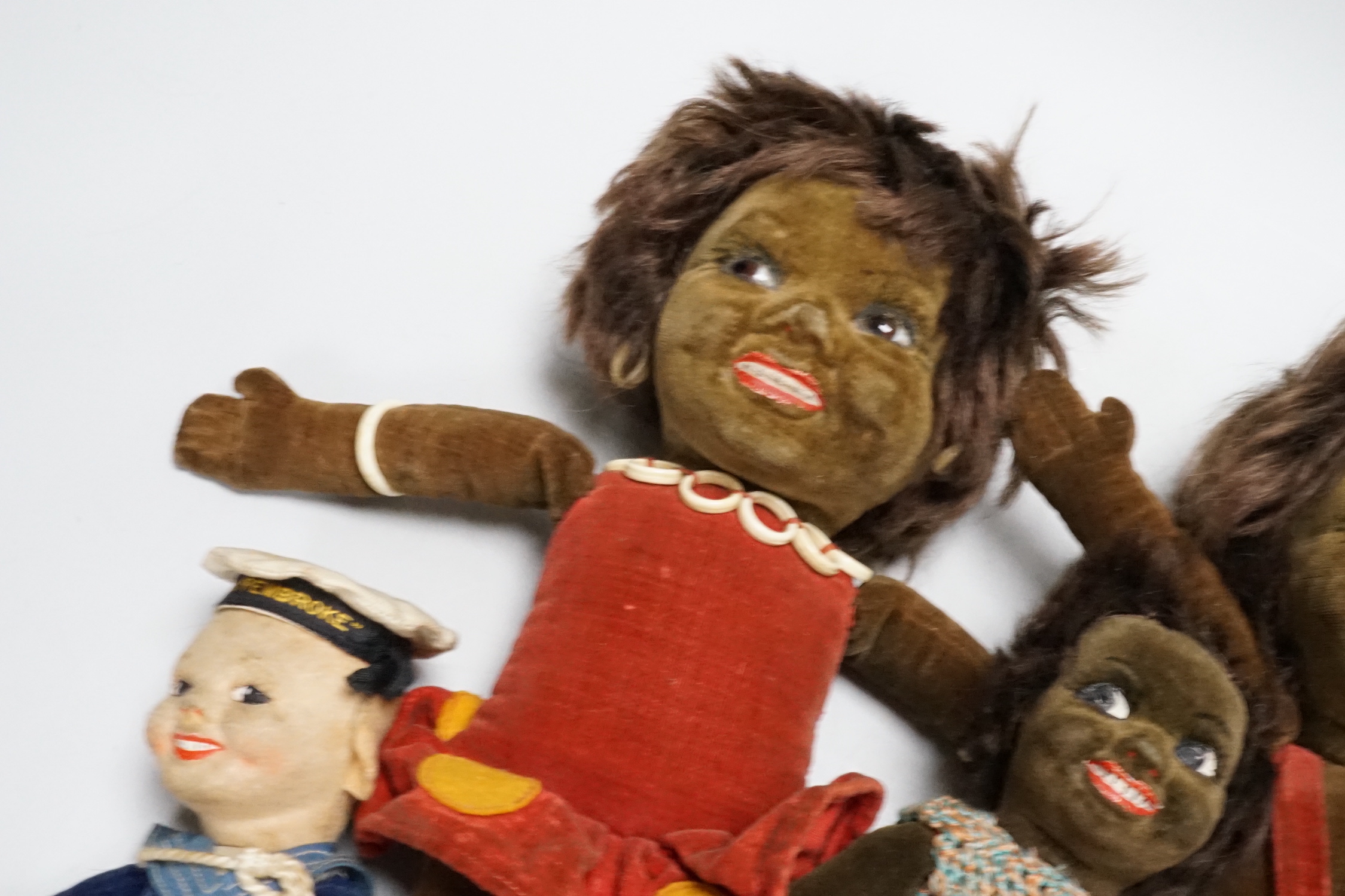 Five Norah Wellings soft toys including three South Sea Islanders, a sailor boy and a monkey, all with labels, monkey 23cm high